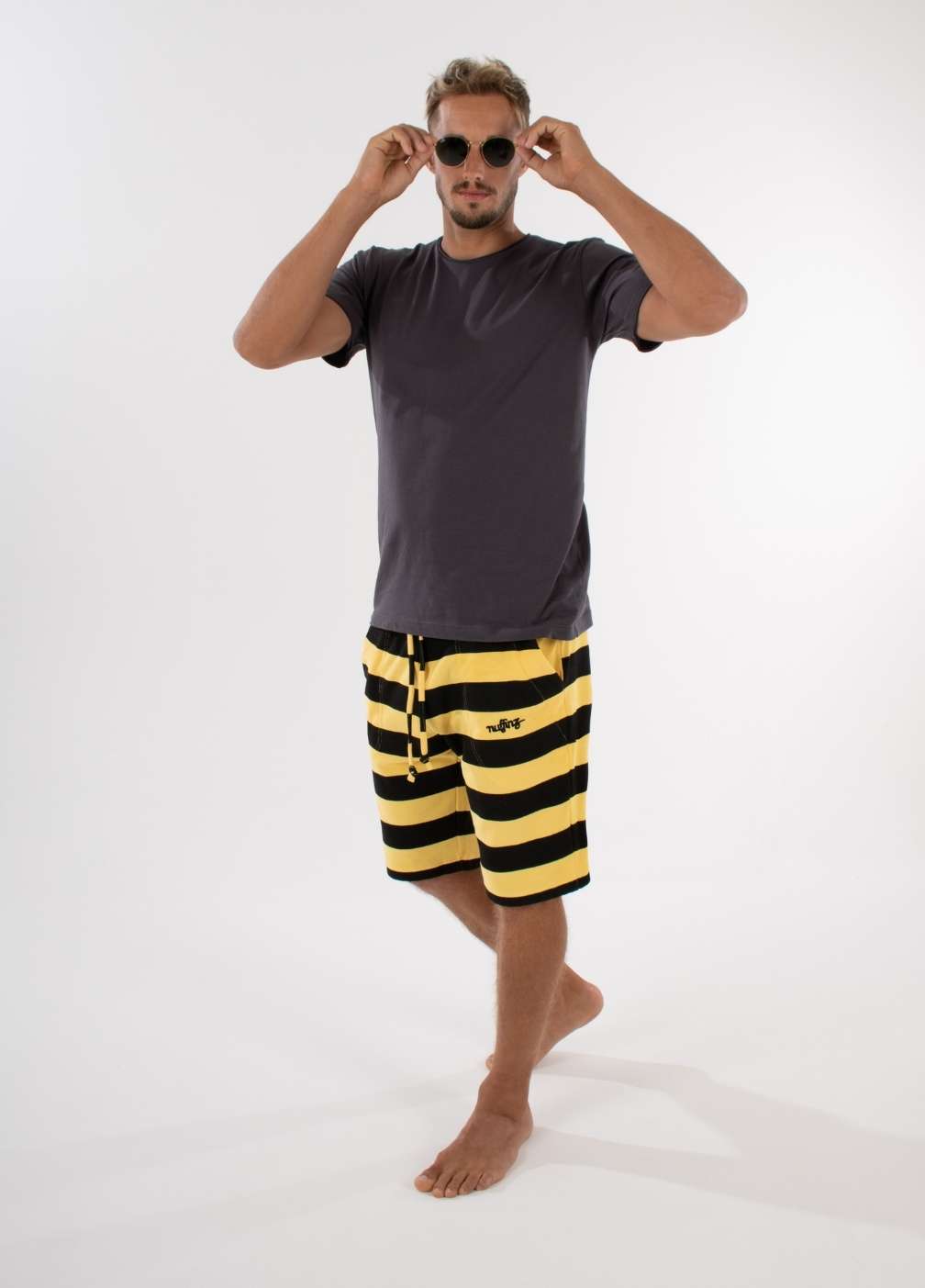 nuffinz YARROW TOWEL SHORTS ST - whole outfit visible from the side / front - made out of organic terry cloth - sustainable men's shorts - sunshine yellow striped